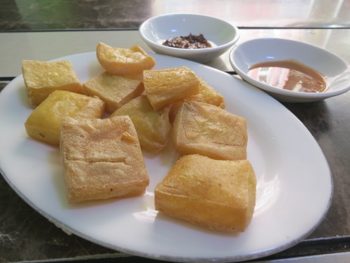 Fried tofu with a spicy dipping sauce is another Shan favorite